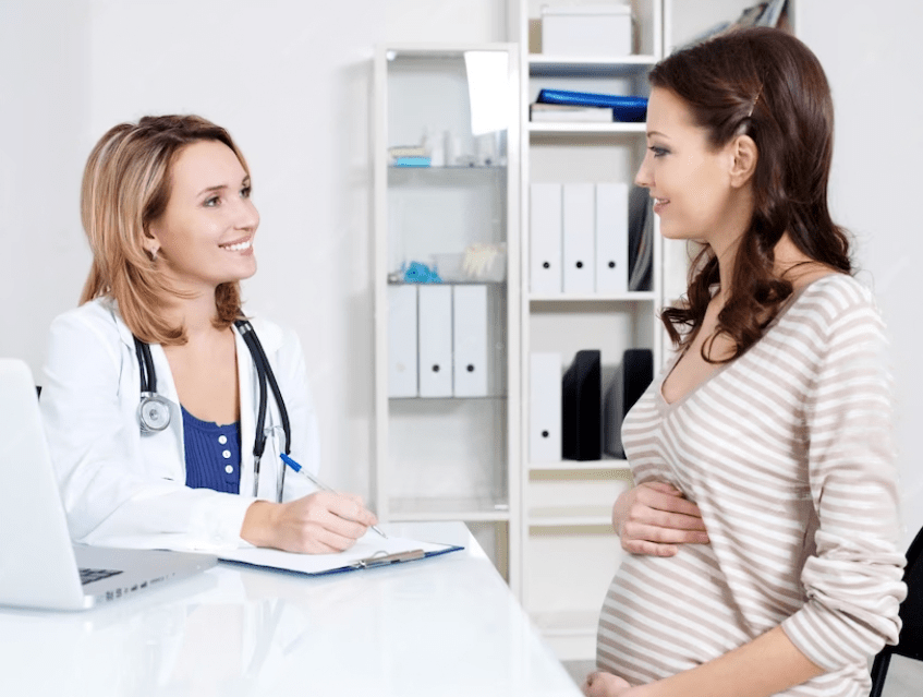 A doctor consults with pregnant women