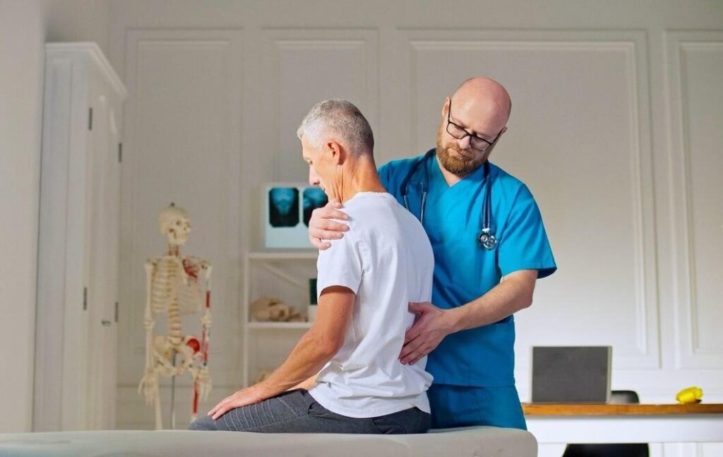 Adult man trains muscle strength with professional doctor