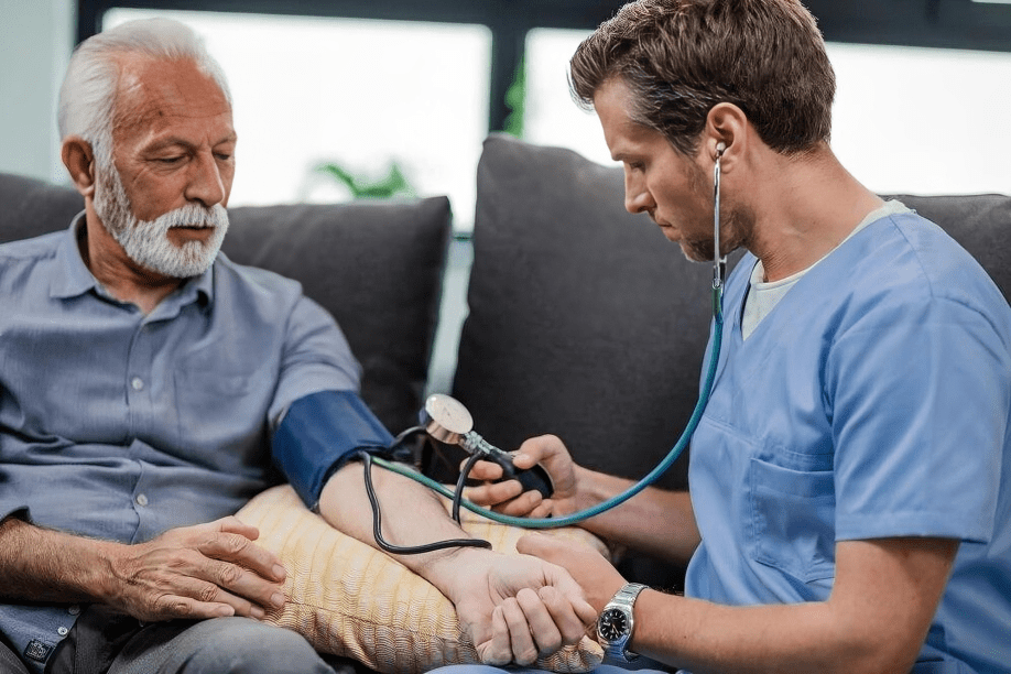 Healthcare worker measuring blood pressure